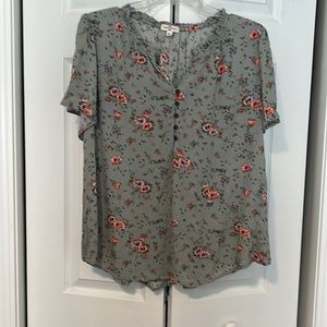 Mason Belle curved hem blouse. Green with violet, peach, green flowered detail.